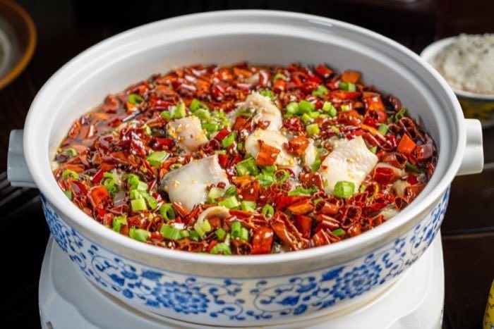Fish poached in a deep pot of chili and Sichuan peppercorn broth